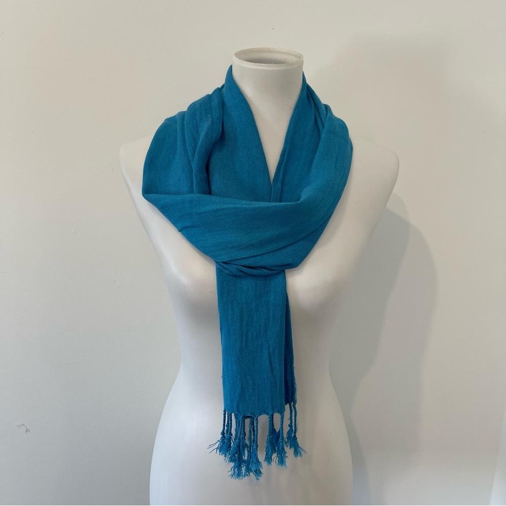 Lightweight soft blue scarf.